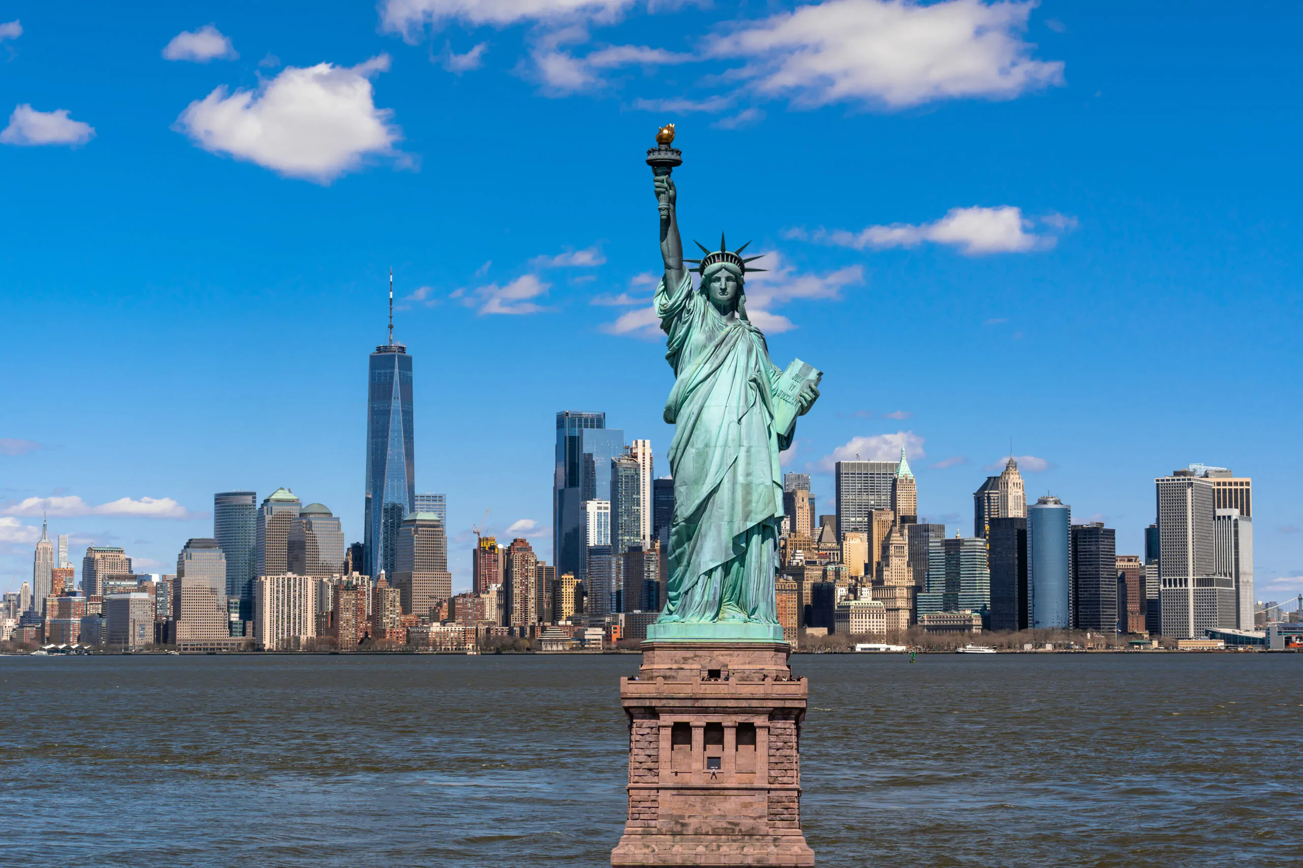 The Statue of Liberty over the Scene of New york cityscape river side which location is lower manhattan,Architecture and building with tourist concept